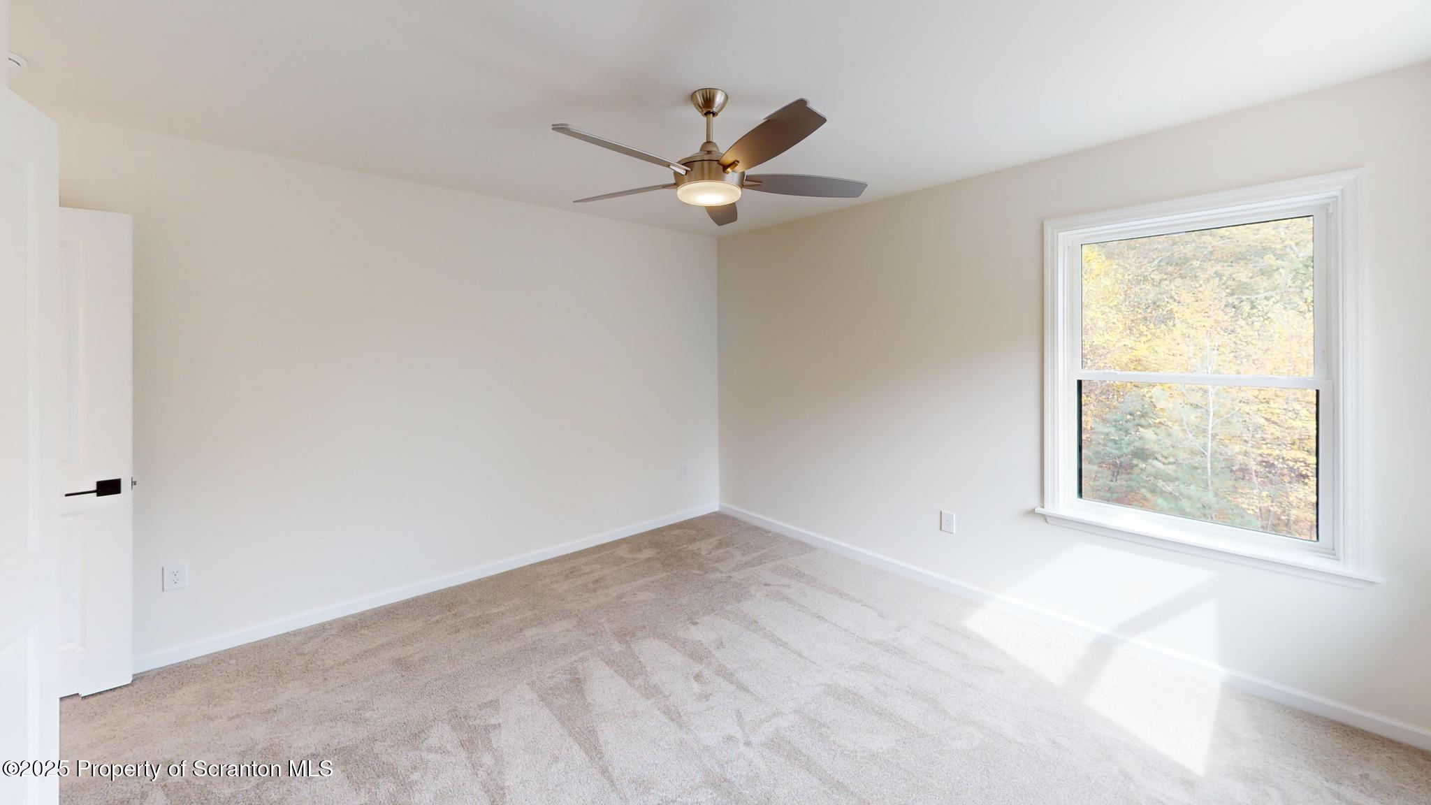 99 Woodland Drive Lake Ariel, PA 18436 - Photo 91 of 124 an empty room with windows and fan