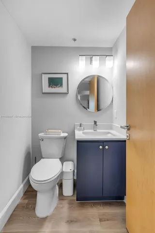 a bedroom with a bed and a night stand