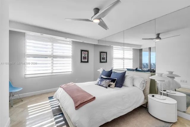 a bed room with a bed and a window