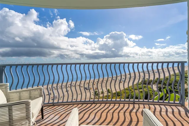 a terrace with outdoor seating and city view