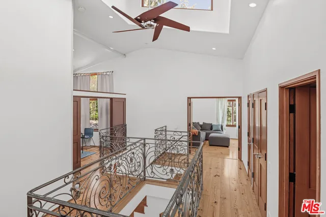 a bed room with a bed window and a television