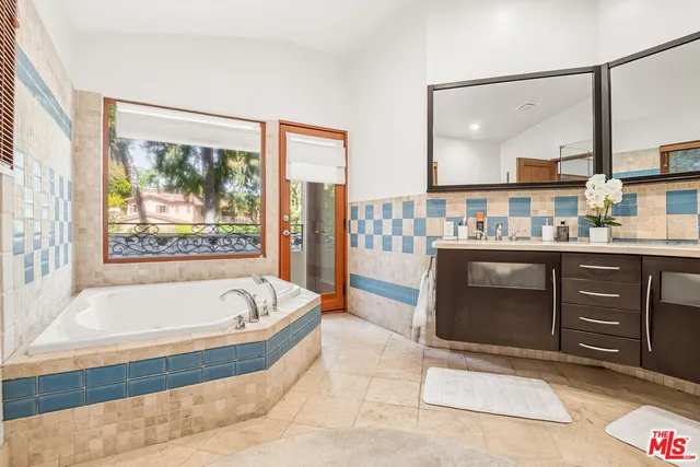 a room with a large window and a view of living room