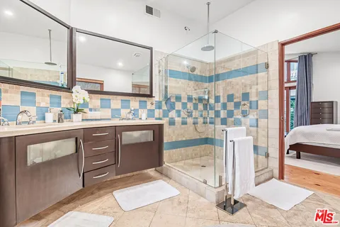 a bedroom with a large bed and a large window