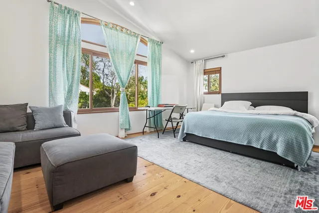 a bathroom with a toilet a sink and shower