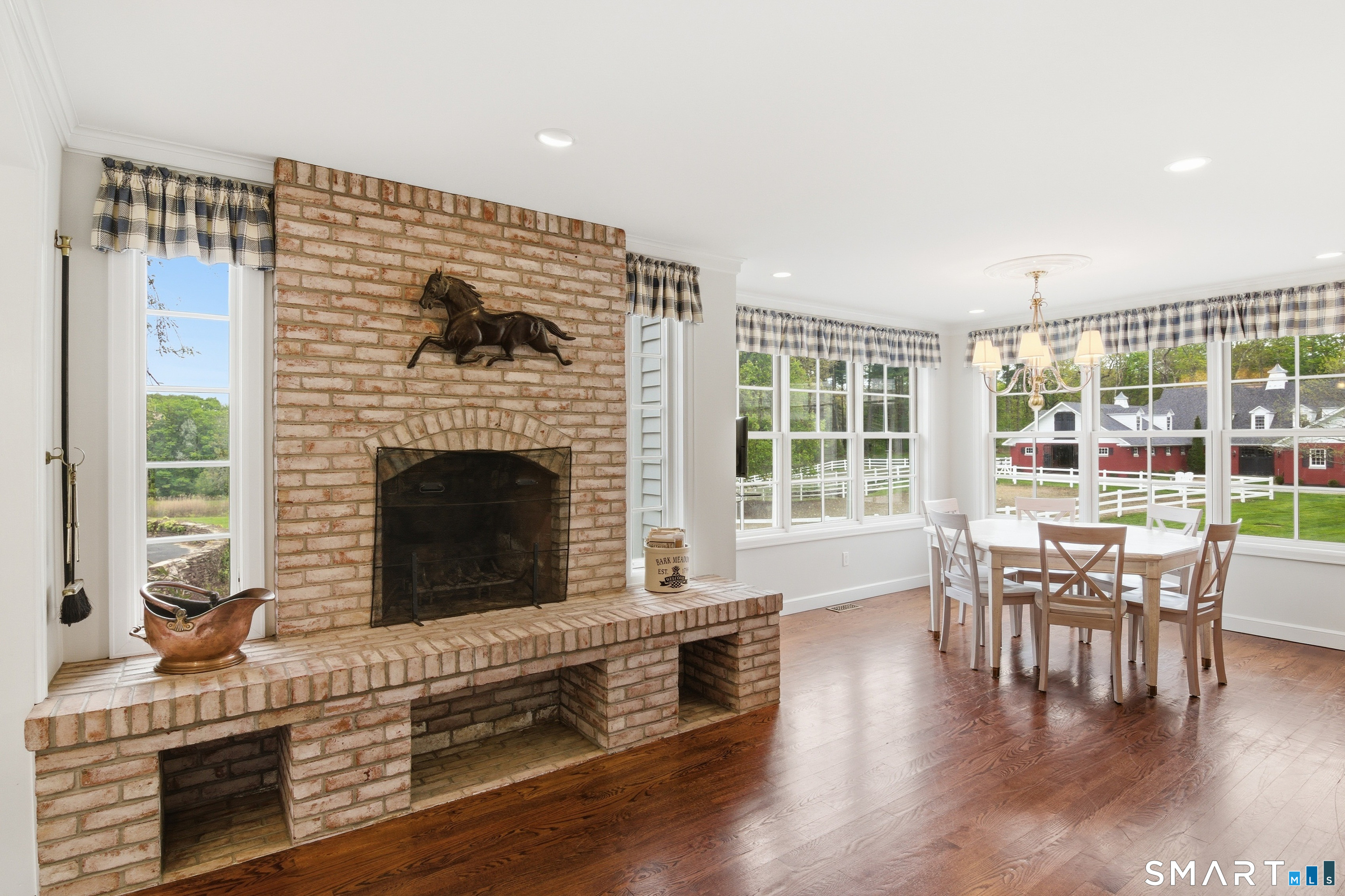 433 Wrights Crossing Road Pomfret, CT 06259 - Photo 18 of 36 Brick wood burning fireplace connects the breakfast room with the kitchen.