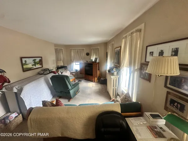 a living room with furniture and a window