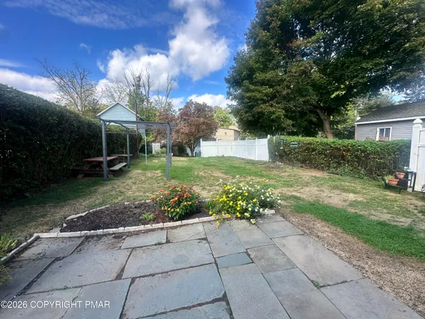 a view of a garden with a fountain
