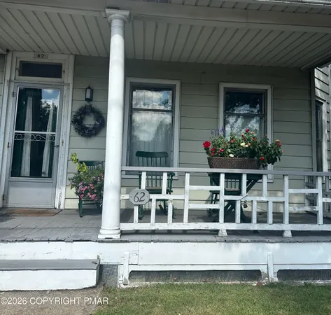 a front view of a house with a porch