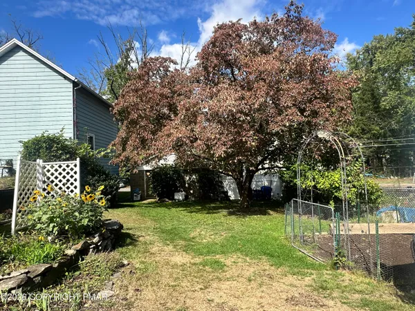 a view of a backyard with a garden