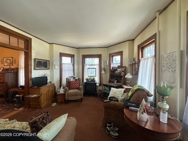 a living room with furniture or couch and a flat screen tv