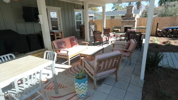 a view of an outdoor dining space with a patio