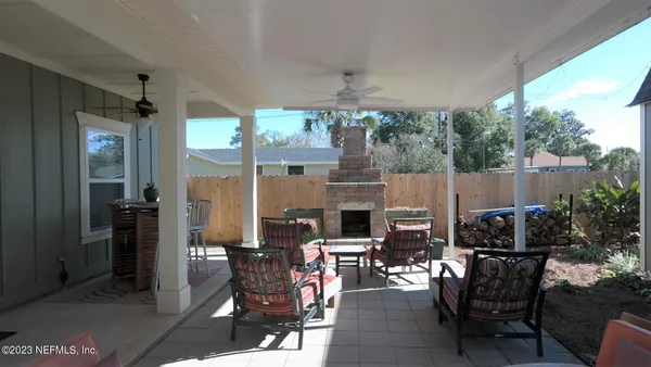 a backyard of a house with outdoor seating