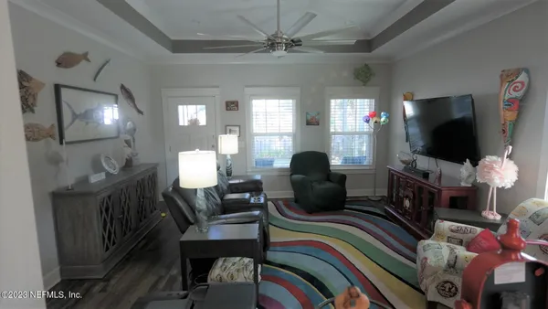 a living room with furniture fireplace and a flat screen tv