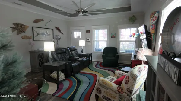 a living room with furniture and a flat screen tv