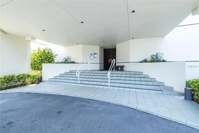 a view of a room with stairs and a couch