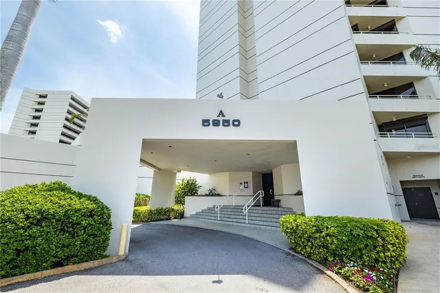 a view of a patio with table and chairs