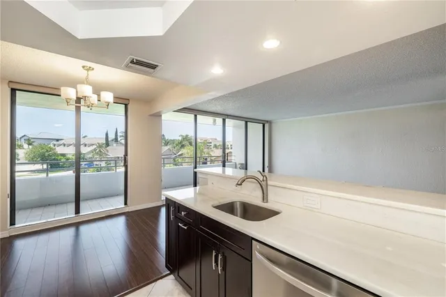 a kitchen with a sink and large window