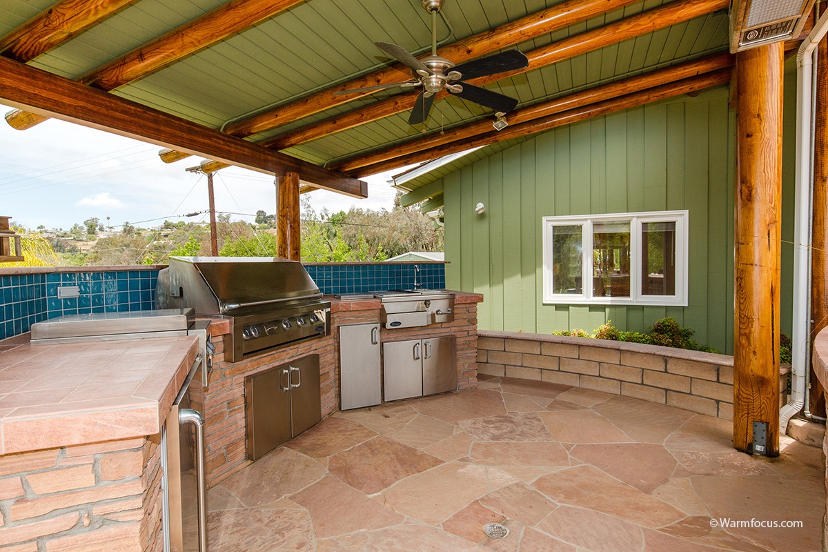 3111 Brookside Lane Encinitas, CA 92024 - Photo 24 of 25 Covered entertaining area includes built-in barbecue, sink, burner, refrig and overhead gas heaters.