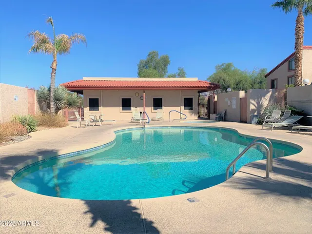 a view of a swimming pool with a patio