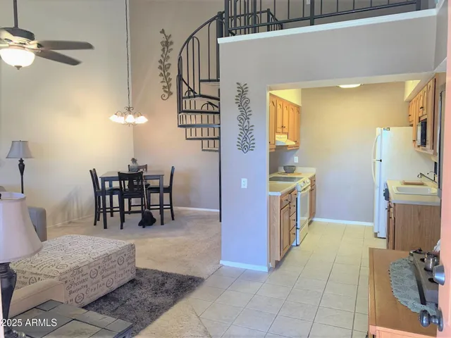 a view of kitchen with furniture and chandelier