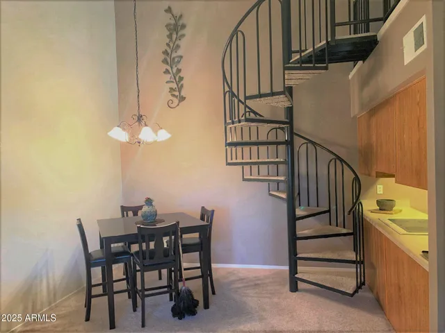 a view of dining room and hall with wooden floor