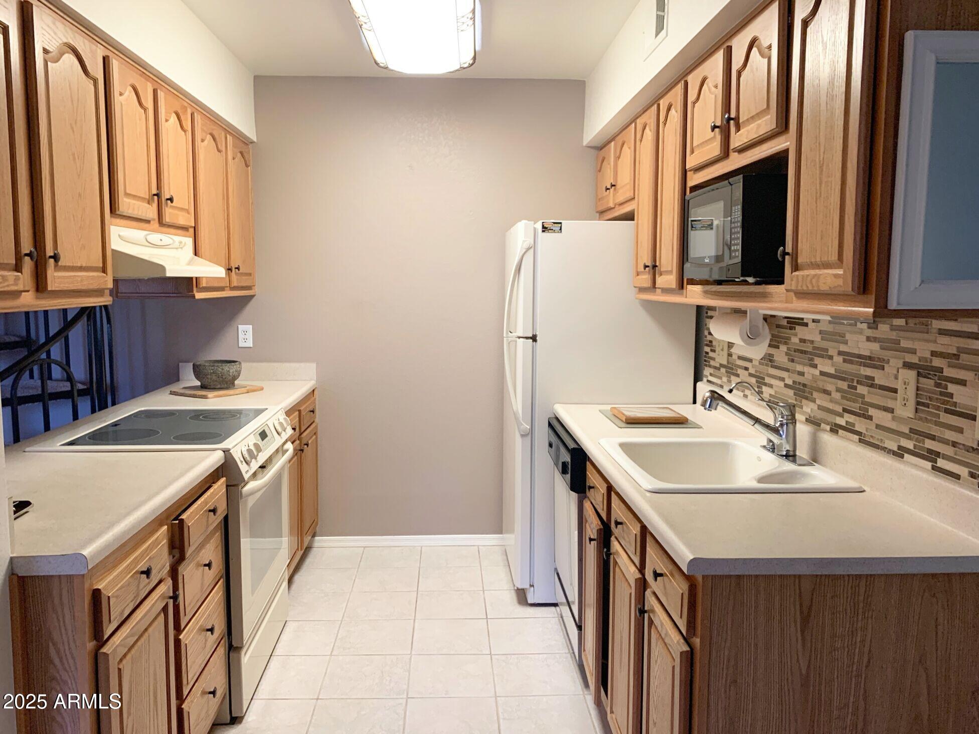 1440 North Idaho Road, Unit 1019 Apache Junction, AZ 85119 - Photo 6 of 14 a bathroom with a sink and a mirror
