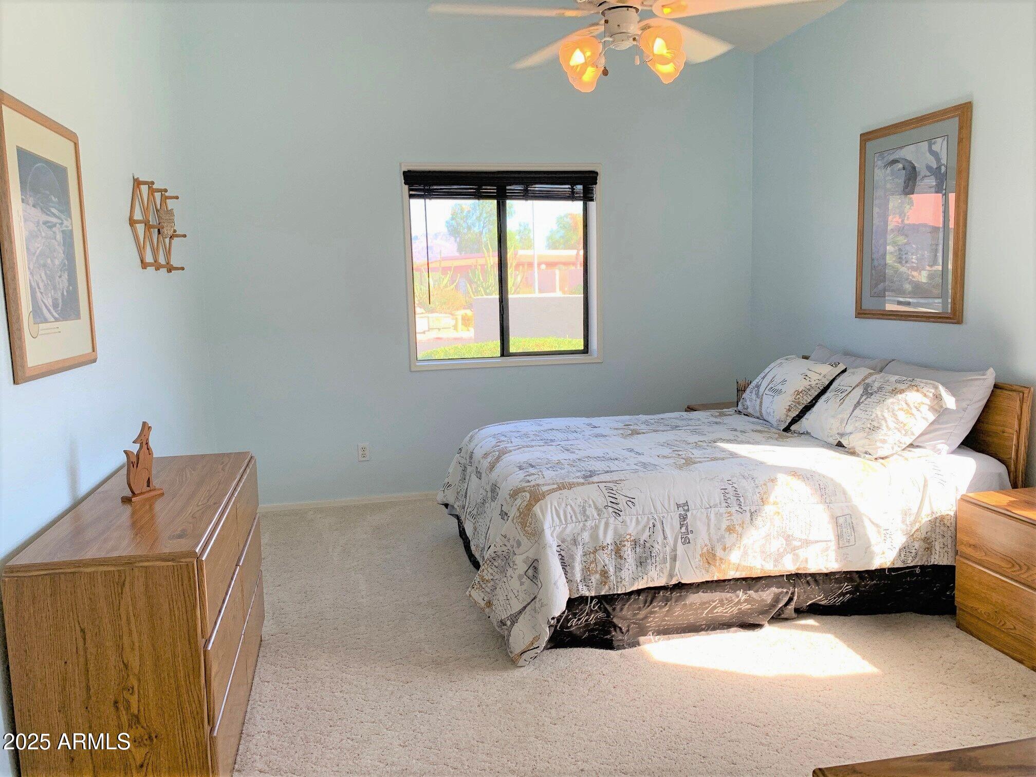 1440 North Idaho Road, Unit 1019 Apache Junction, AZ 85119 - Photo 7 of 14 a bedroom with a bed and window
