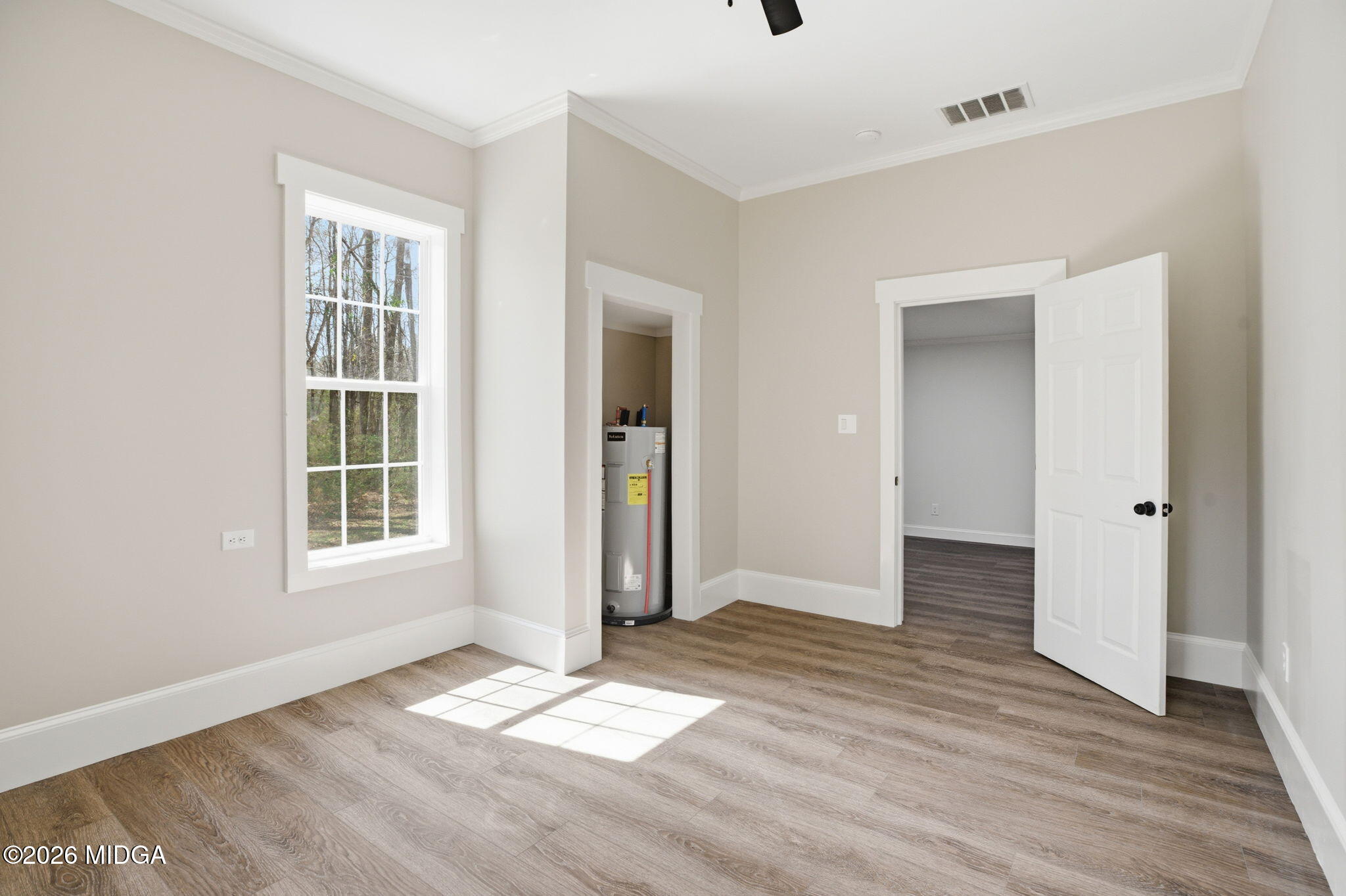 3181 Dames Ferry Road Forsyth, GA 31029 - Photo 35 of 36 an empty room with wooden floor and windows