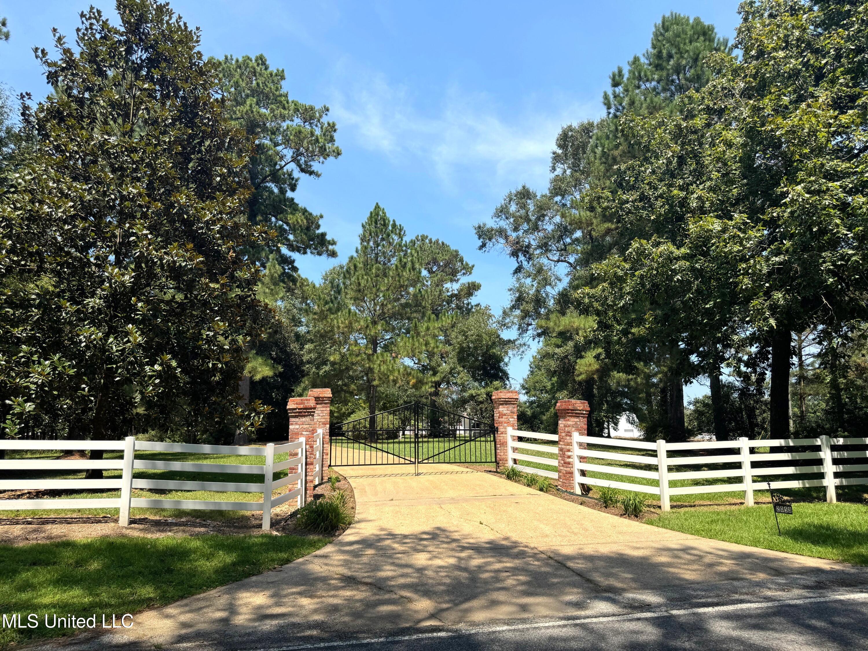 2053 Osyka Progress Road Osyka, MS 39657 - Photo 2 of 49 RG- Gated entrance gate closed
