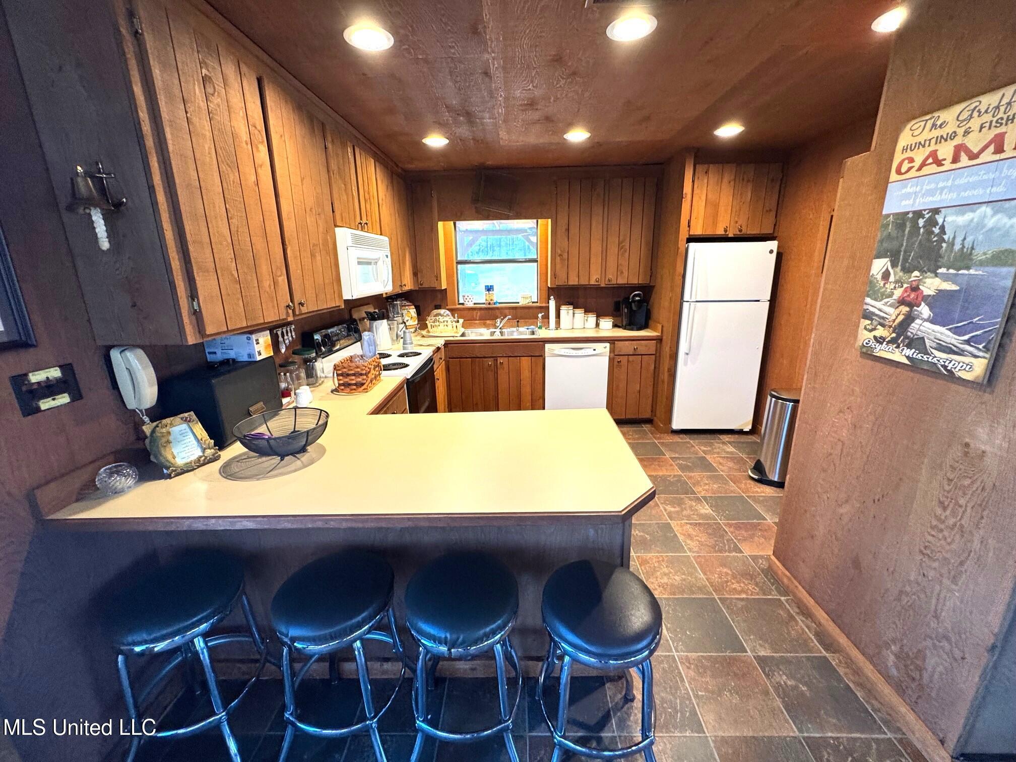 2053 Osyka Progress Road Osyka, MS 39657 - Photo 40 of 49 RG - Lake house bar to kitchen