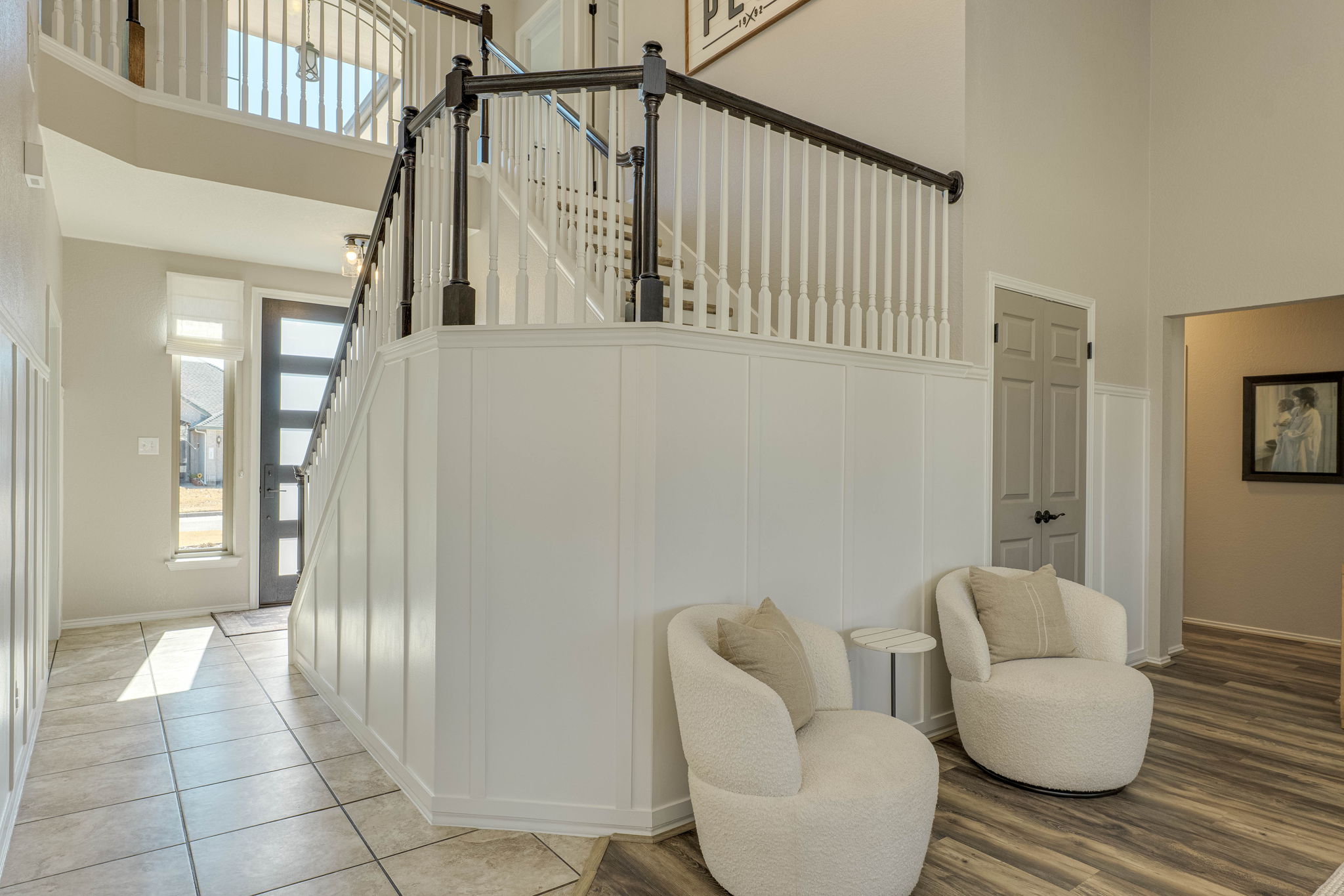 703 Ridge View Drive Leander, TX 78641 - Photo 12 of 39 Stairs with a high ceiling, plenty of natural light, a decorative wall, and wood finished floors
