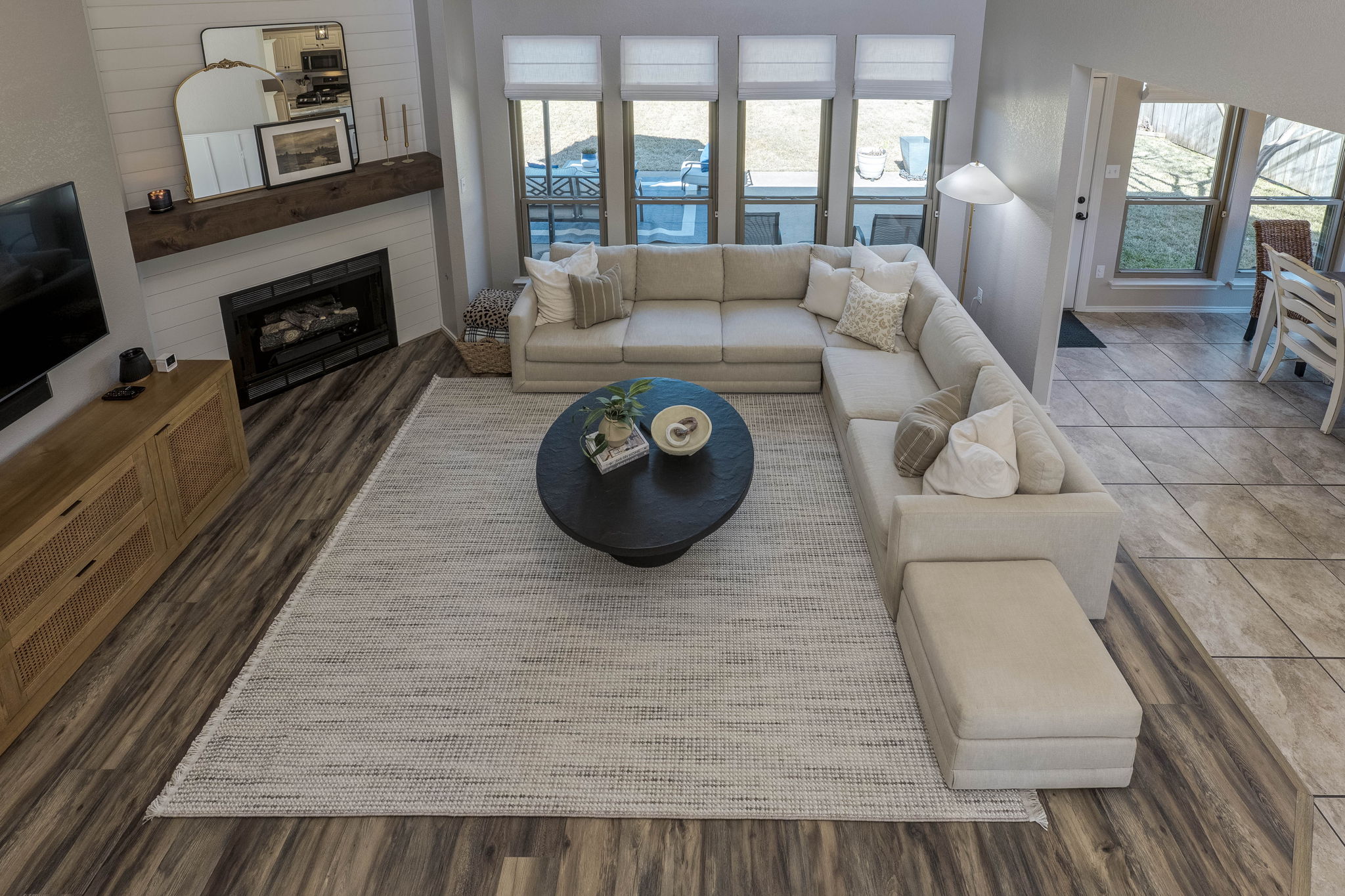703 Ridge View Drive Leander, TX 78641 - Photo 22 of 39 Living room featuring dark wood-type flooring and a fireplace