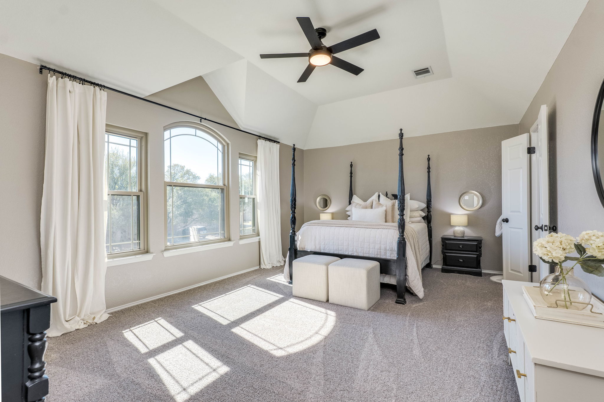 703 Ridge View Drive Leander, TX 78641 - Photo 26 of 39 Bedroom with light colored carpet, a ceiling fan, and a raised ceiling