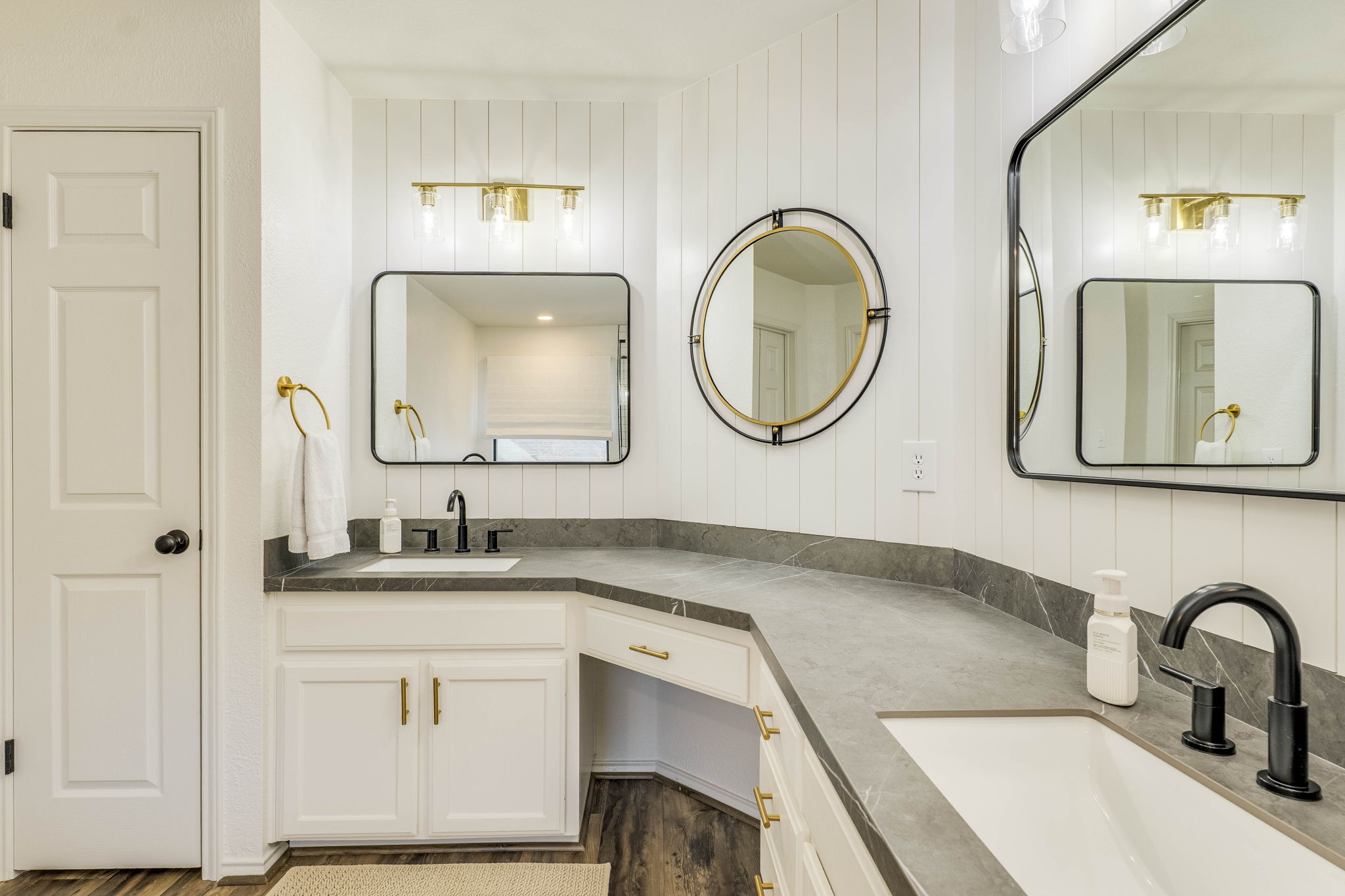 703 Ridge View Drive Leander, TX 78641 - Photo 29 of 39 Bathroom with double vanity and wooden walls