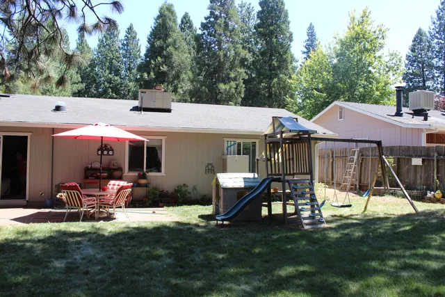 a bathroom with a toilet and a shower curtain