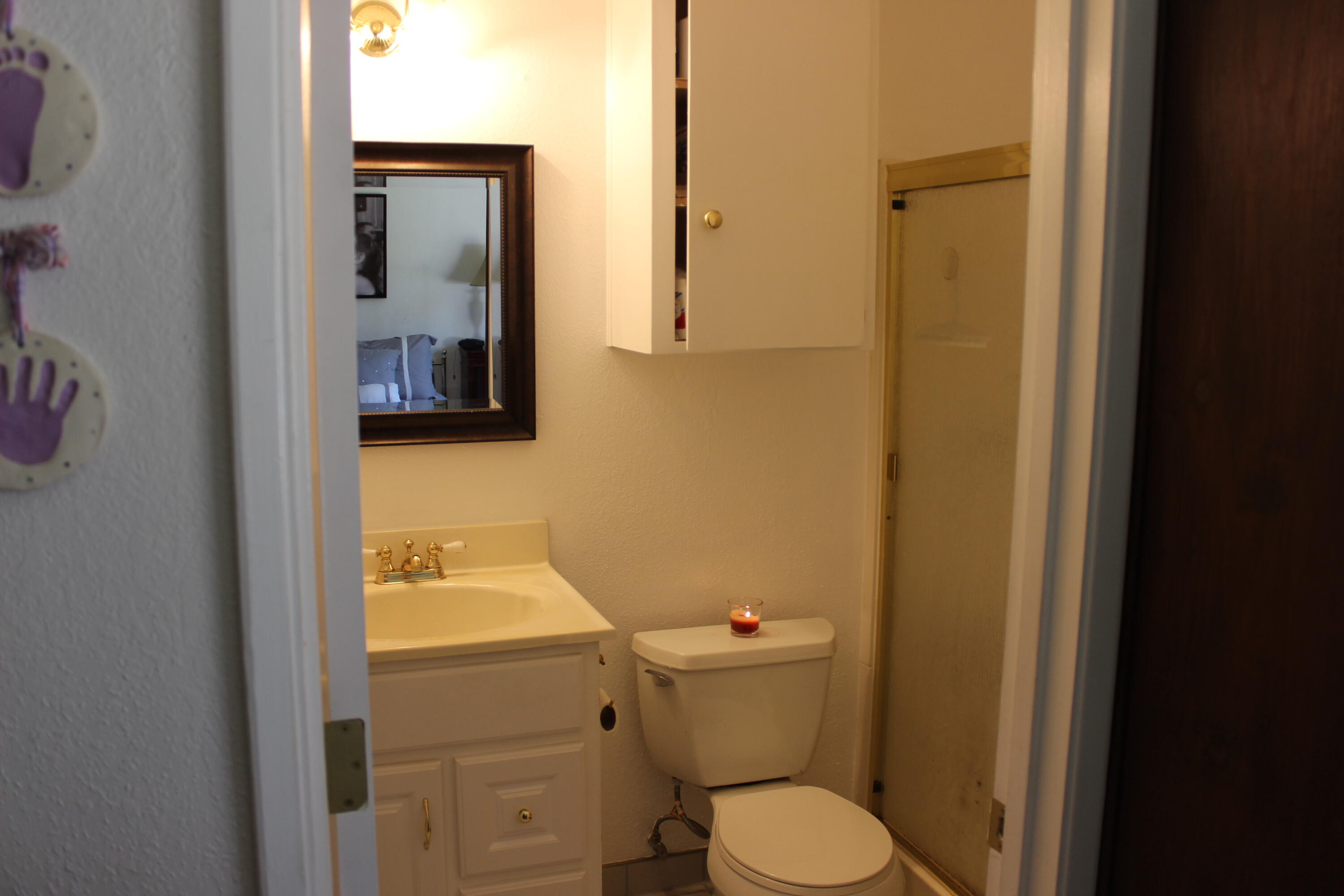 20244 Arrowood Street Burney, CA 96013 - Photo 19 of 19 a bathroom with a toilet sink and mirror