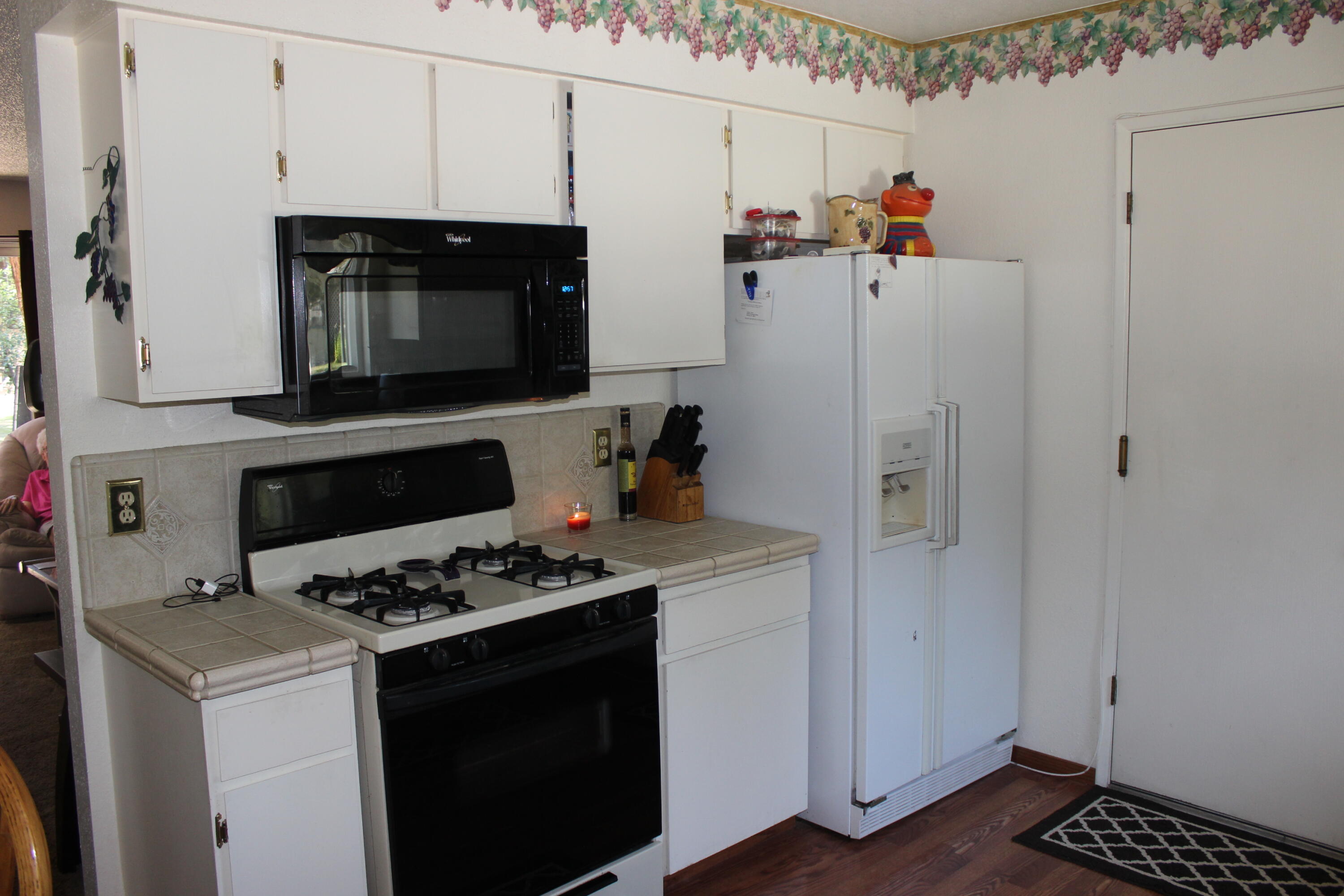 20244 Arrowood Street Burney, CA 96013 - Photo 4 of 19 a kitchen with cabinets and appliances