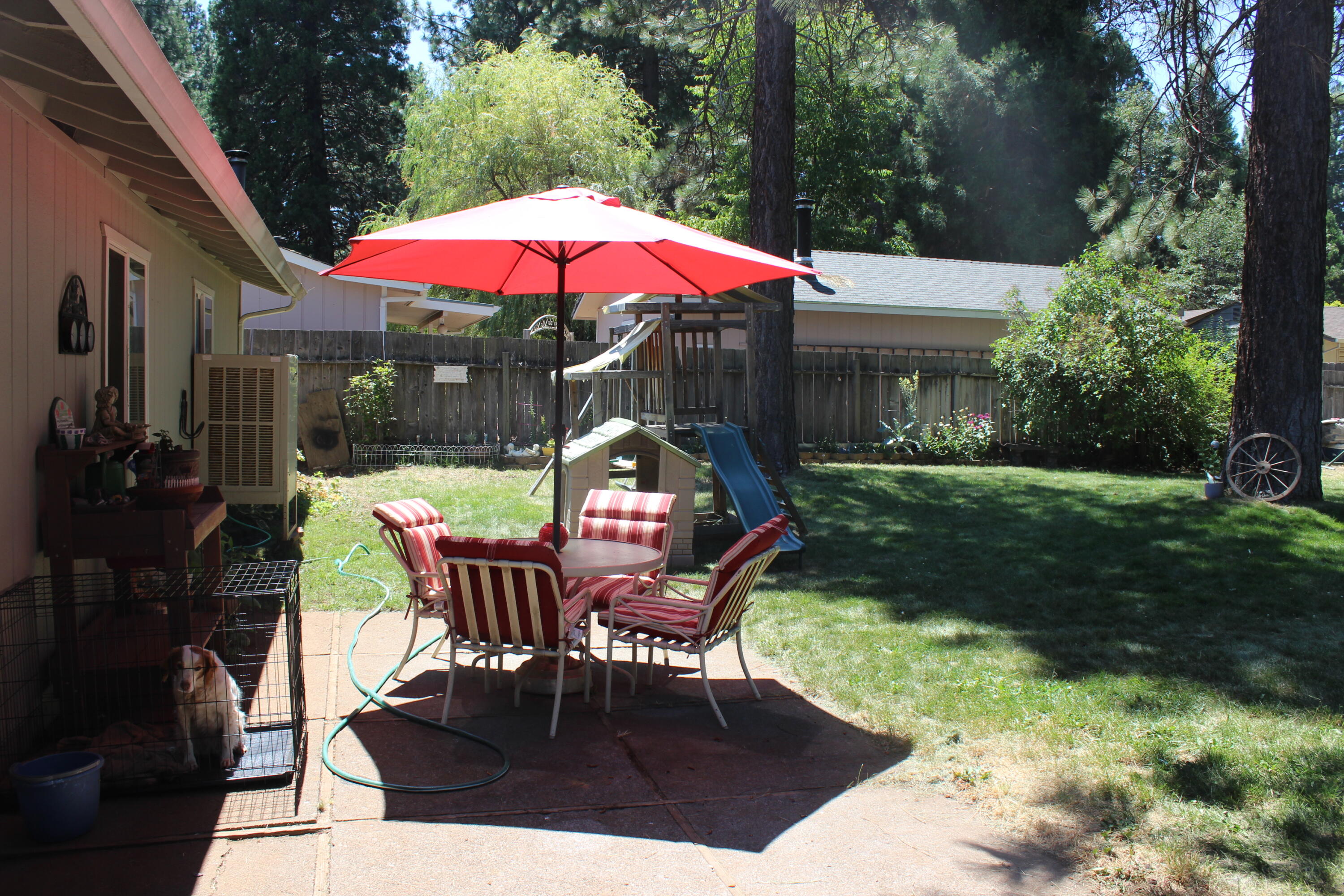 20244 Arrowood Street Burney, CA 96013 - Photo 9 of 19 a patio with tables and chairs
