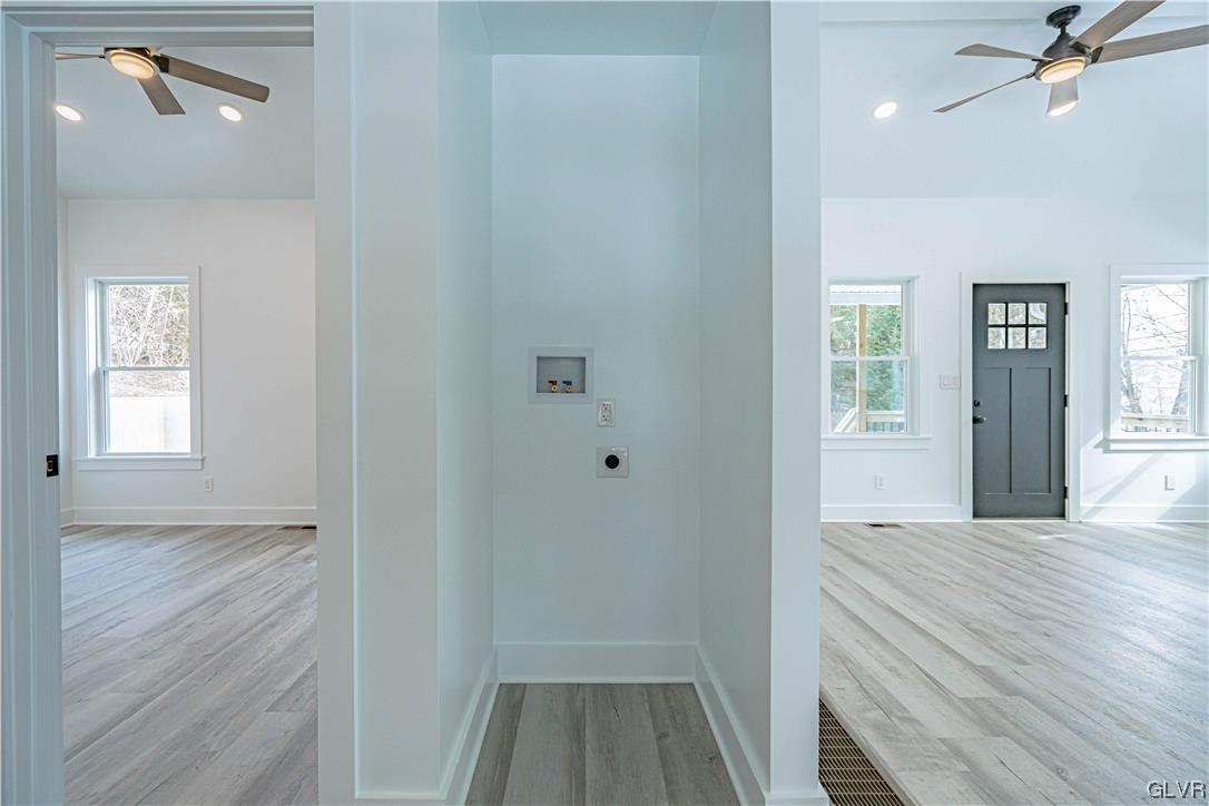 677 Gall Road Nazareth, PA 18064 - Photo 16 of 27 a view of a hallway with wooden floor and a bathroom