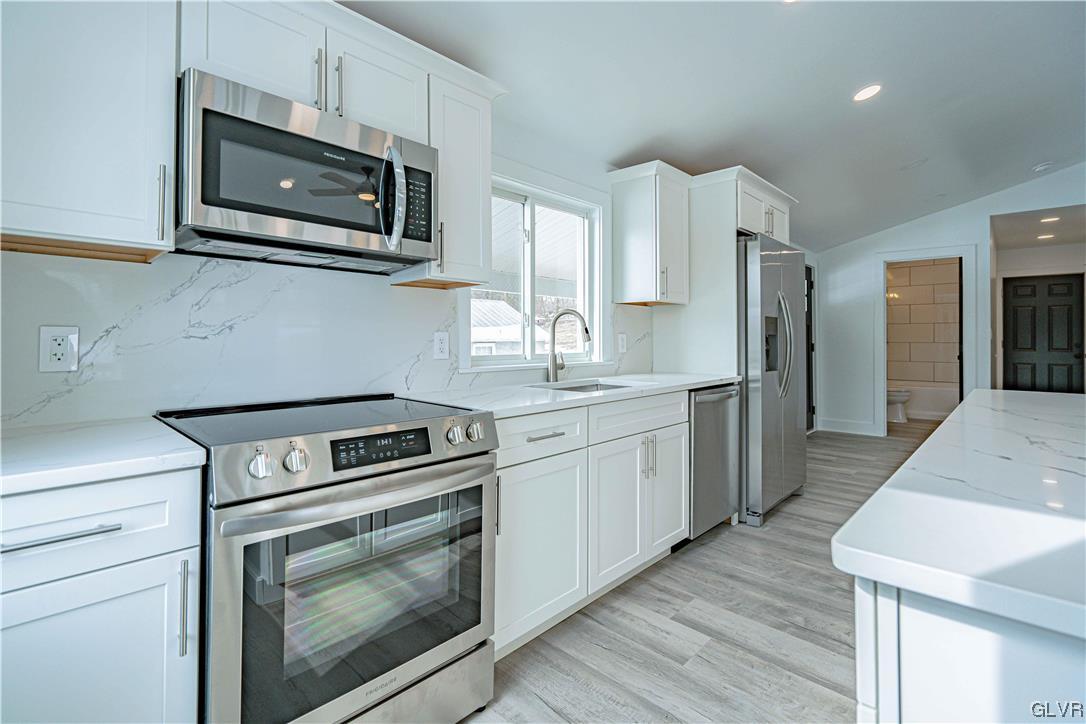 677 Gall Road Nazareth, PA 18064 - Photo 7 of 27 a kitchen with stainless steel appliances a stove microwave and sink