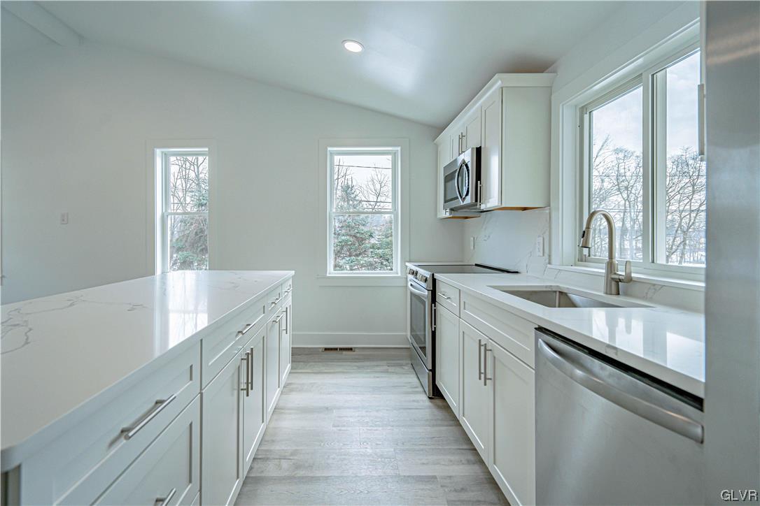 677 Gall Road Nazareth, PA 18064 - Photo 8 of 27 a kitchen with granite countertop a sink stove and cabinets