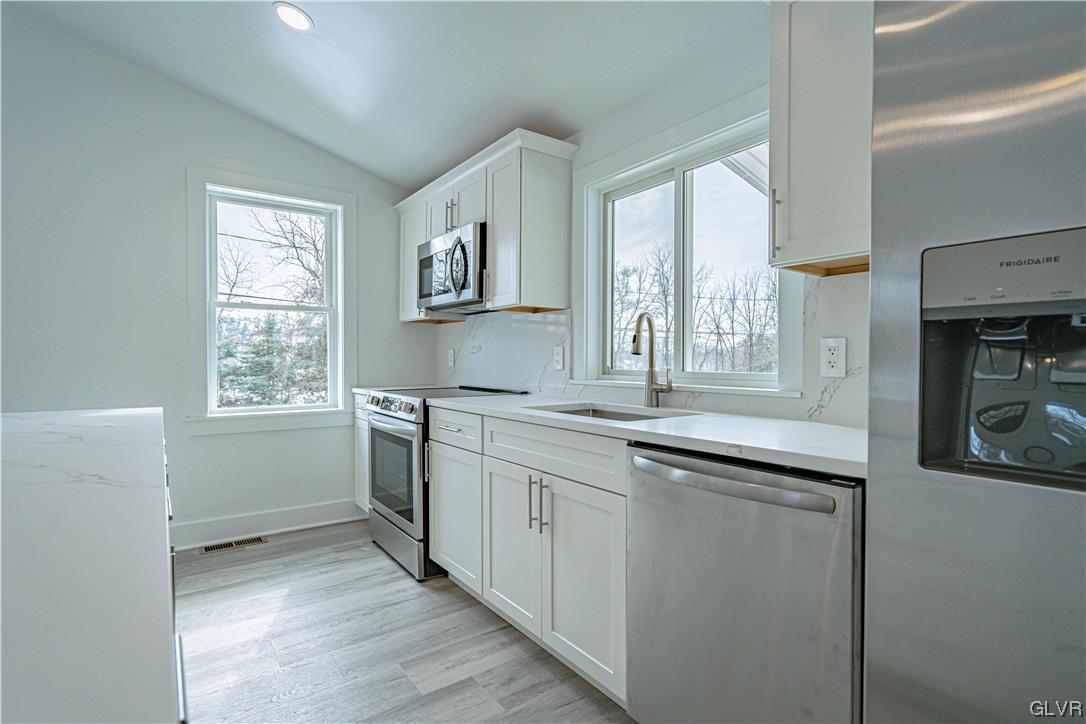 677 Gall Road Nazareth, PA 18064 - Photo 9 of 27 a kitchen with granite countertop a sink and a window