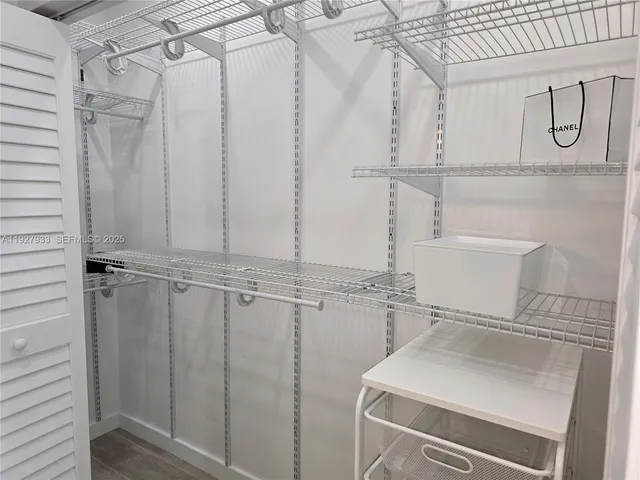 a bathroom with a shower curtain and sink