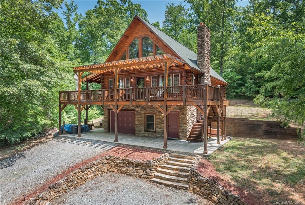 83 Cross Ridge Drive Rutherfordton, NC 28139 - Photo 1 of 38 a front view of a house with a yard