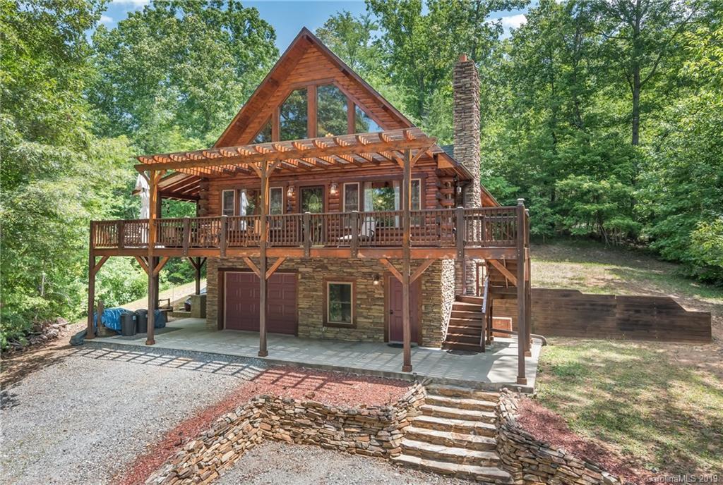 83 Cross Ridge Drive Rutherfordton, NC 28139 - Photo 2 of 38 a front view of a house with a yard