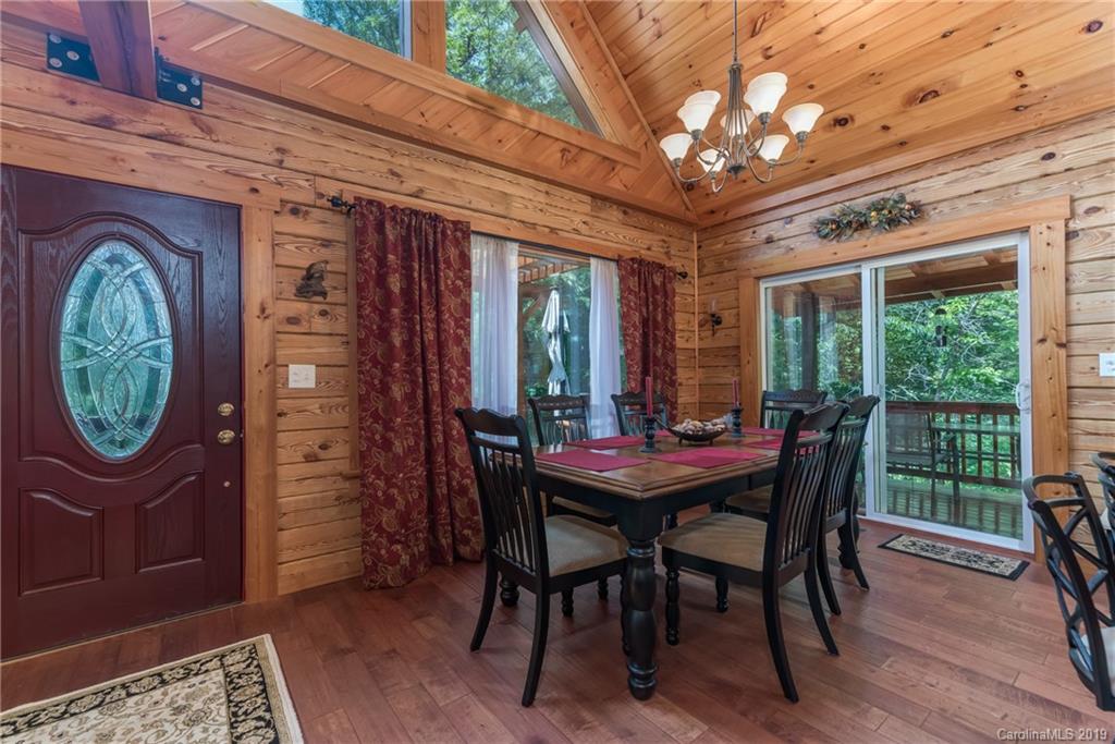 83 Cross Ridge Drive Rutherfordton, NC 28139 - Photo 11 of 38 a dining room with furniture a chandelier and a rug