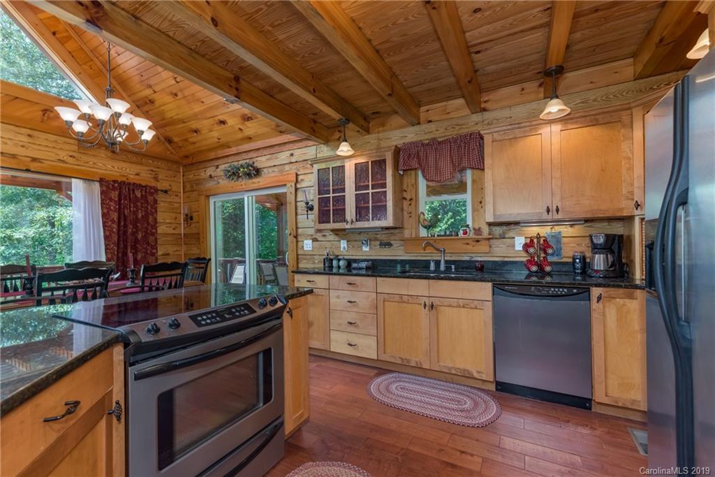 83 Cross Ridge Drive Rutherfordton, NC 28139 - Photo 15 of 38 a kitchen with lots of counter top space and wooden floor