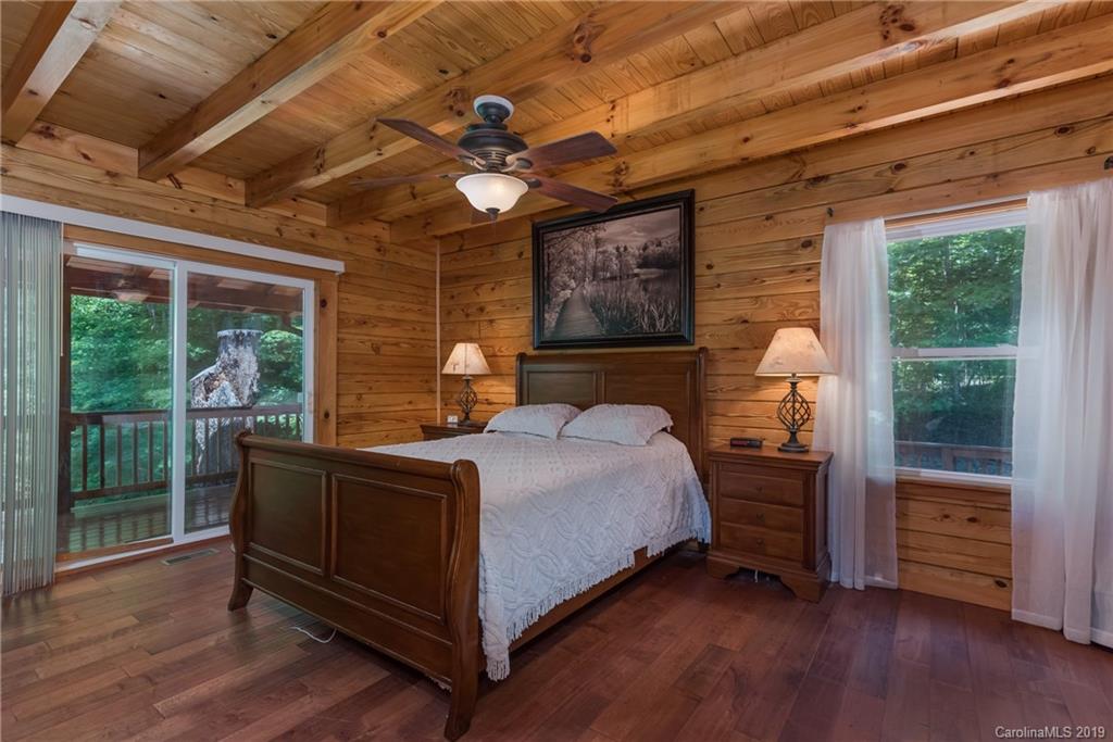83 Cross Ridge Drive Rutherfordton, NC 28139 - Photo 16 of 38 a bedroom with a bed and a large window