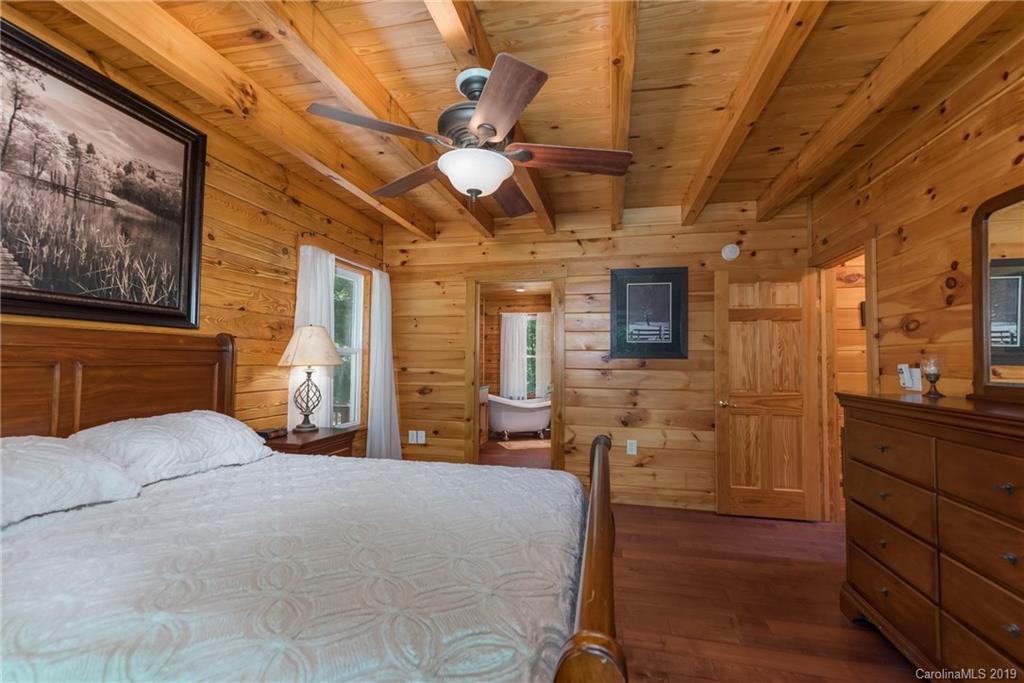 83 Cross Ridge Drive Rutherfordton, NC 28139 - Photo 17 of 38 a bedroom with furniture and wooden floor