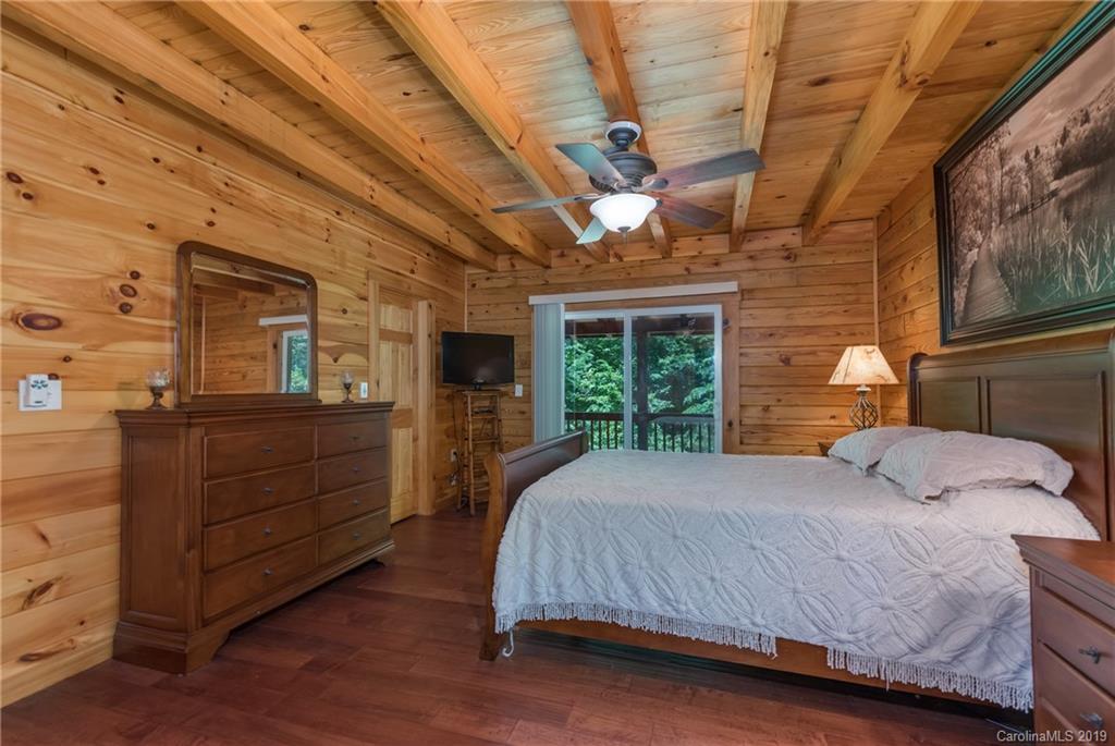 83 Cross Ridge Drive Rutherfordton, NC 28139 - Photo 20 of 38 a bedroom with a bed and a large window